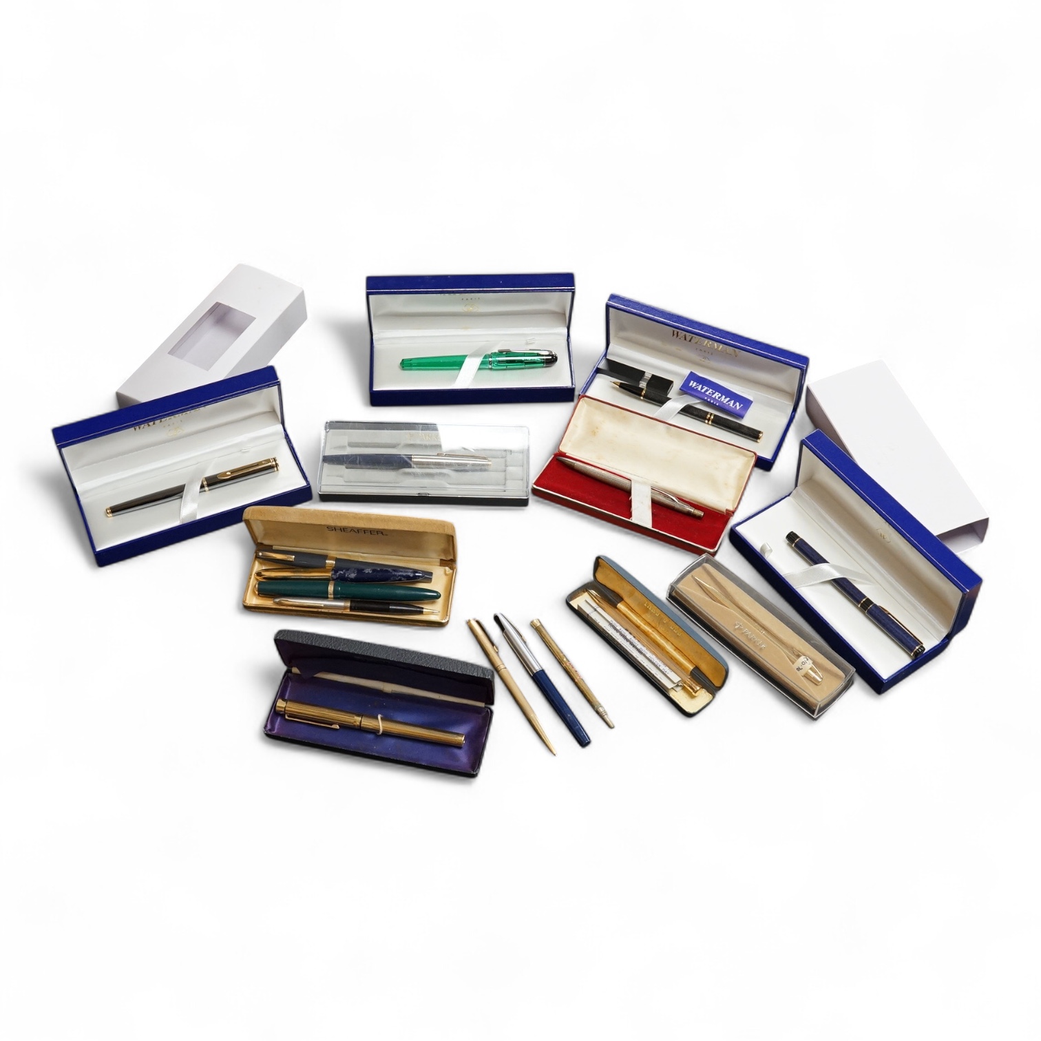 Four assorted cased Waterman pens, elven other assorted pens including Scheaffer and Parker and an engine turned silver pen.